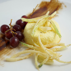 Parmesan Flan Savory Flan Served with Pickled Grapes and Crispy Leeks